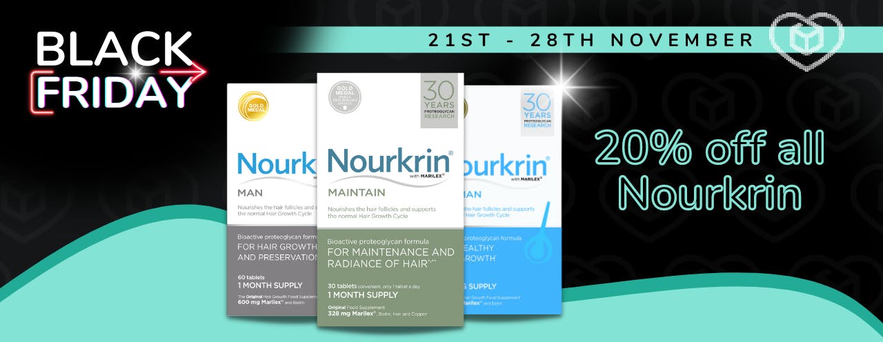 Three Nourkrin supplements for hair growth on a black background