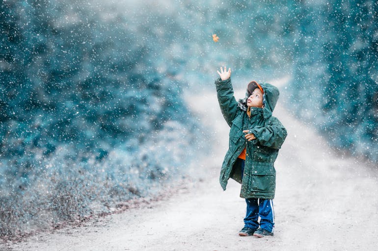 Child in the snow during winter