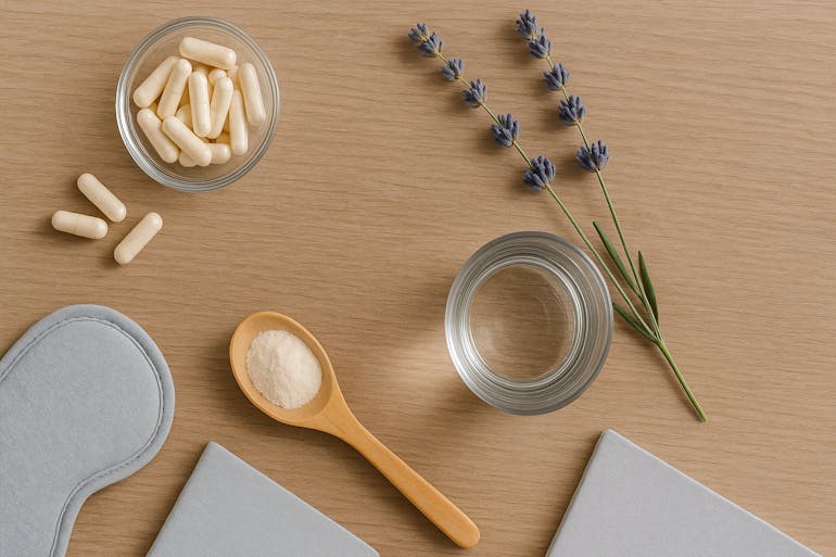 magnesium pills, a spoon of powder and a sleep mask