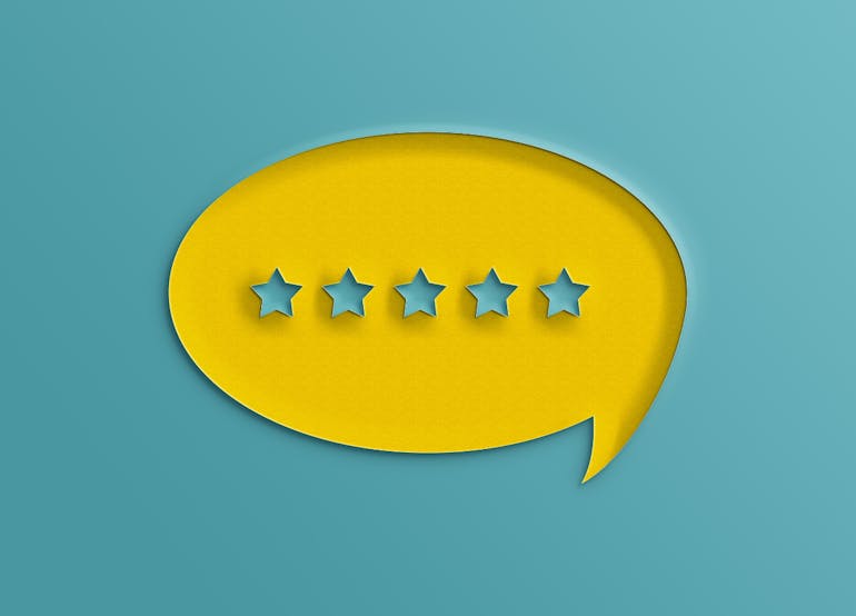 Image of text bubble in yellow with five blue stars inside