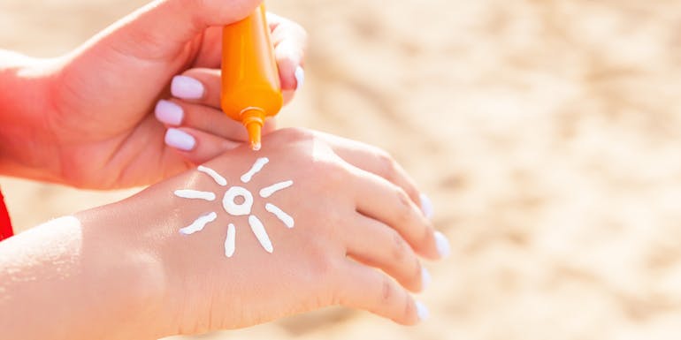 sun cream on a hand