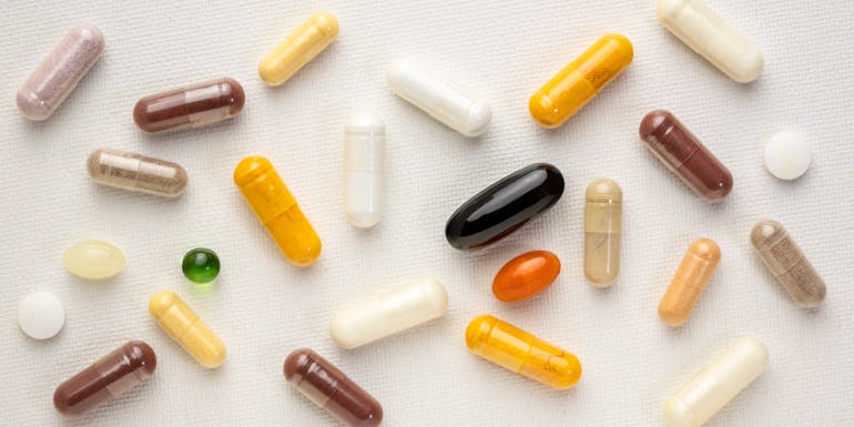 scattered pills and vitamins